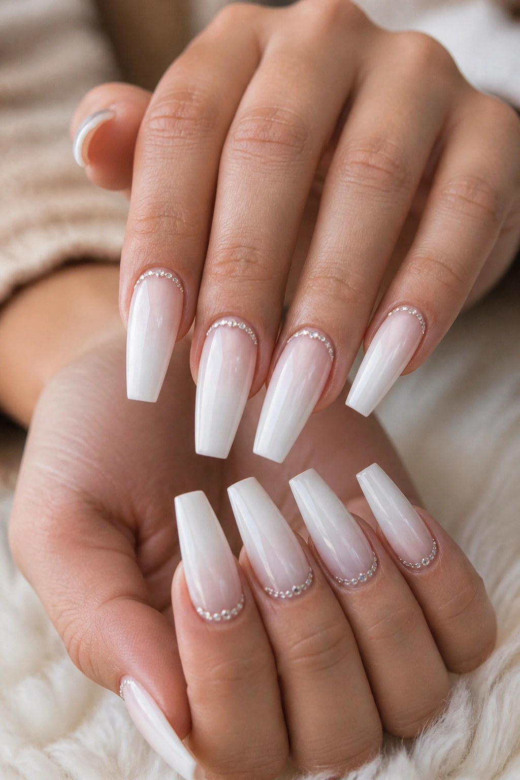 Close-up of coffin nails with crystal cuticle arcs on a real hand