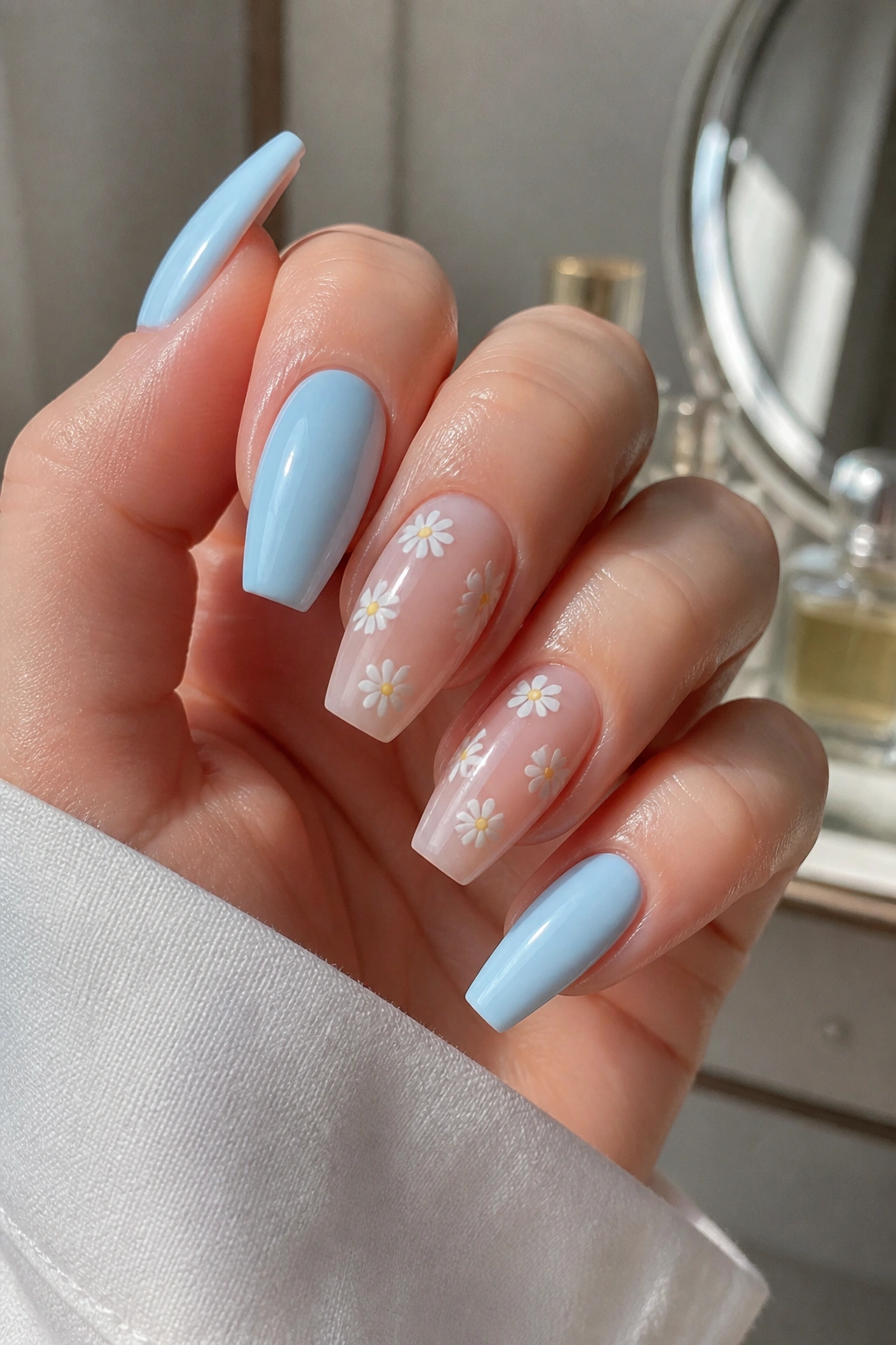 Close-up of coffin nails with tiny white daisies accent nails