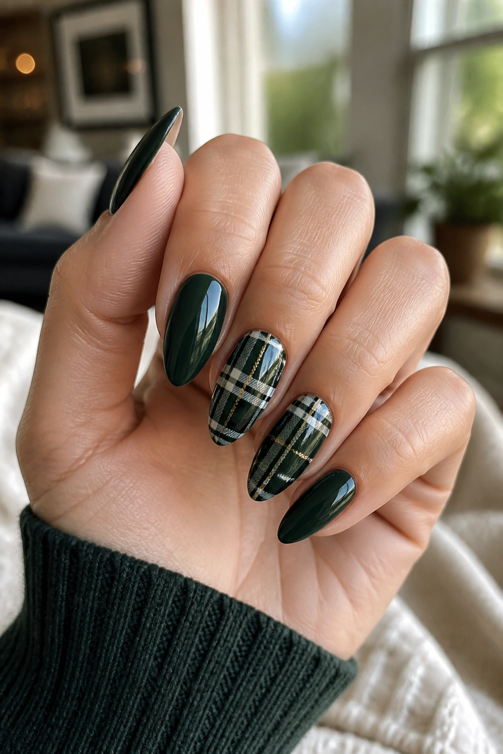 Dark green plaid almond nails on a real hand