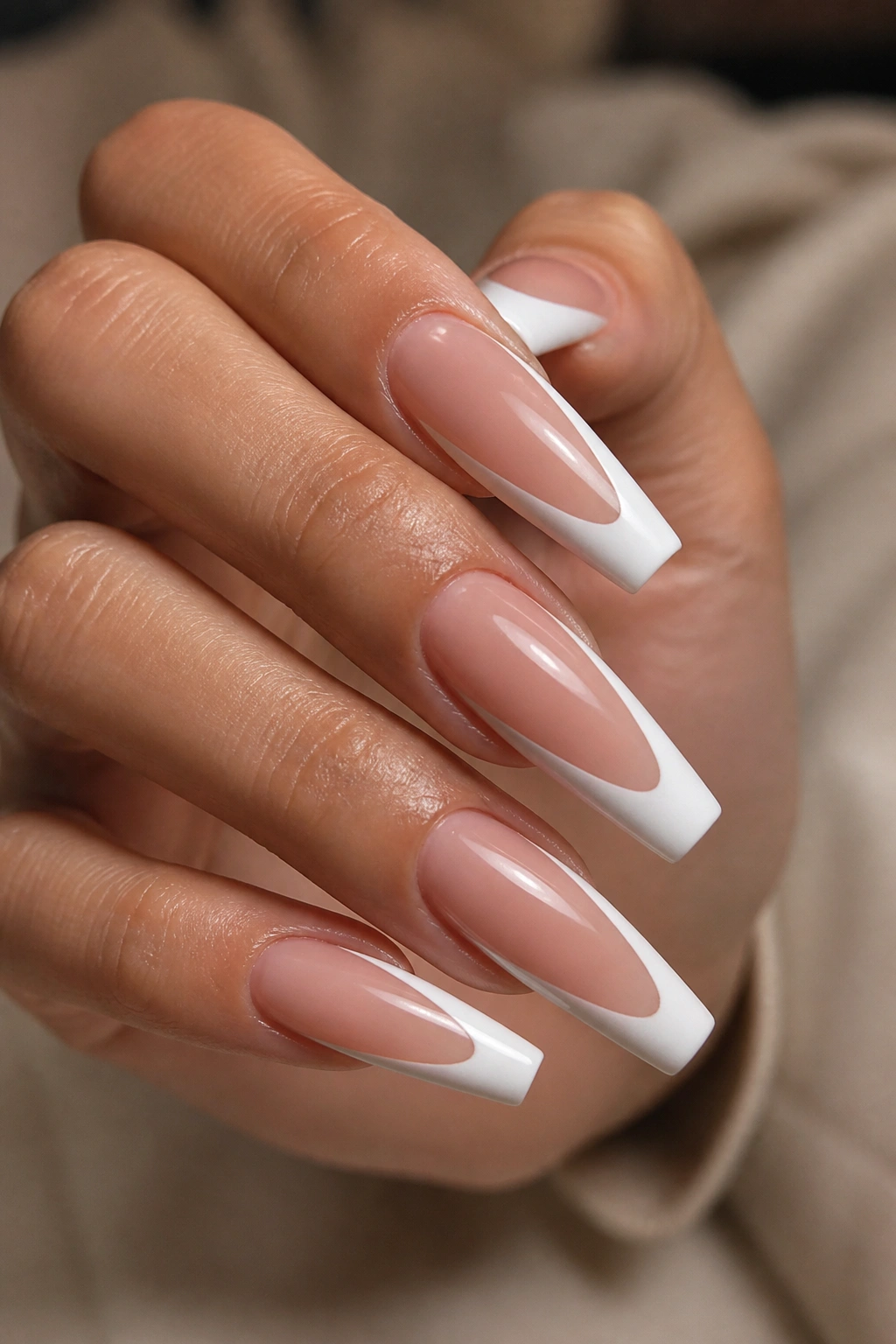 Coffin nails with deep smile line white tips in a salon