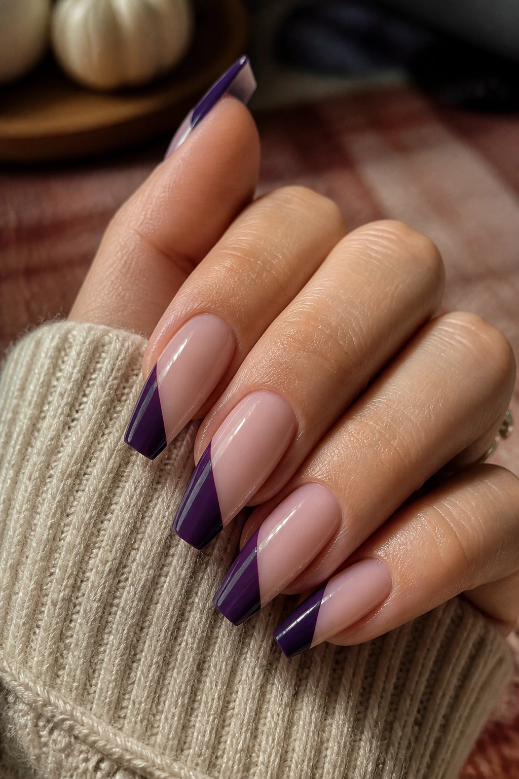 Eggplant and nude diagonal color-block coffin nails close-up
