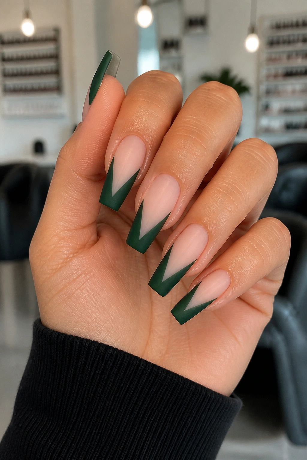 Close-up of forest green V-cut coffin nails with negative space