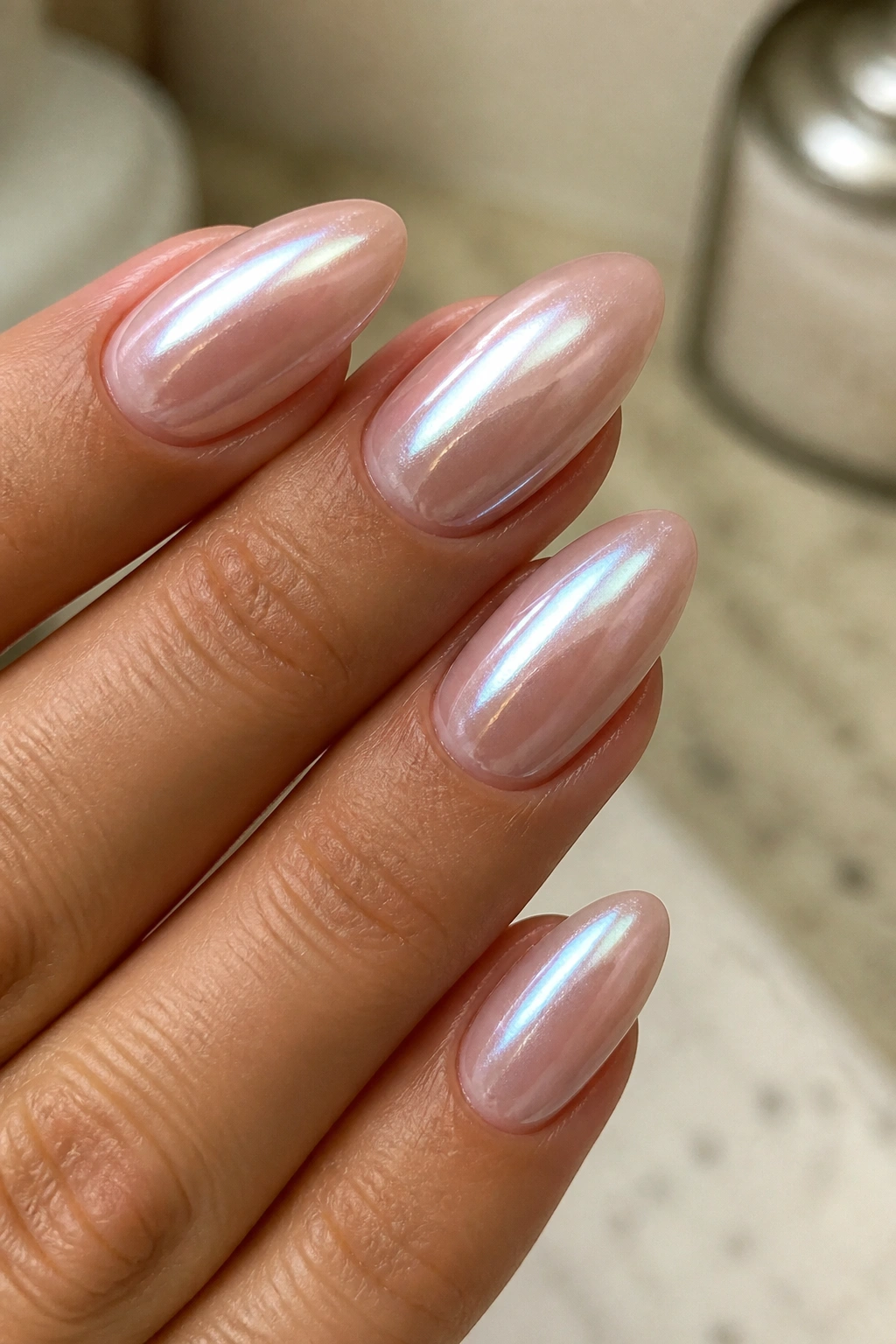 Nude base almond nails with milky opalescent glaze