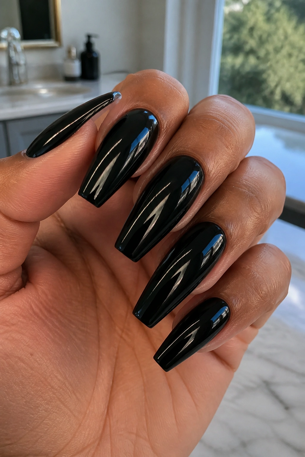 Medium-length coffin nails with glossy jet-black finish