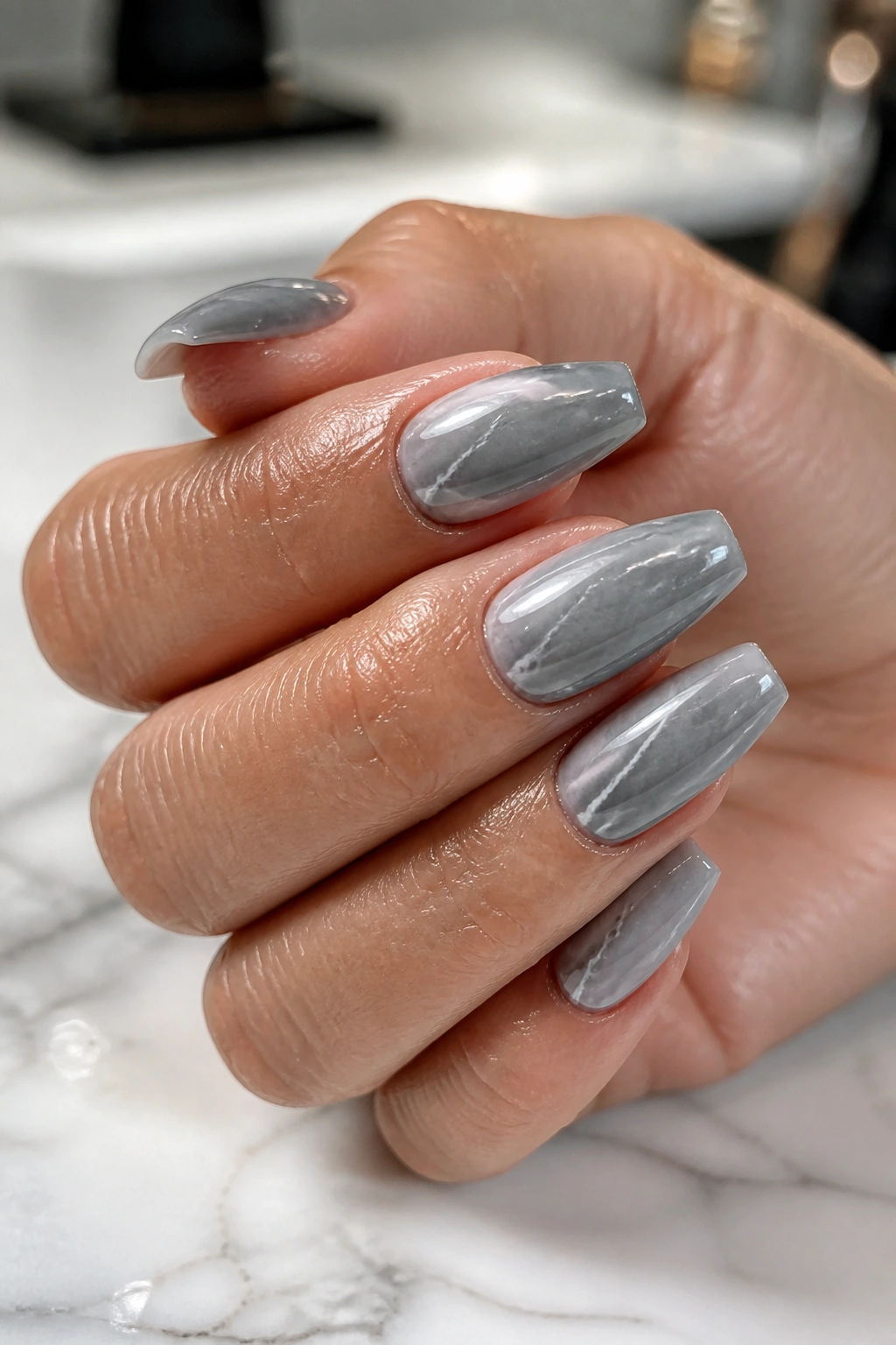 Close-up grey marble coffin nails with white veining