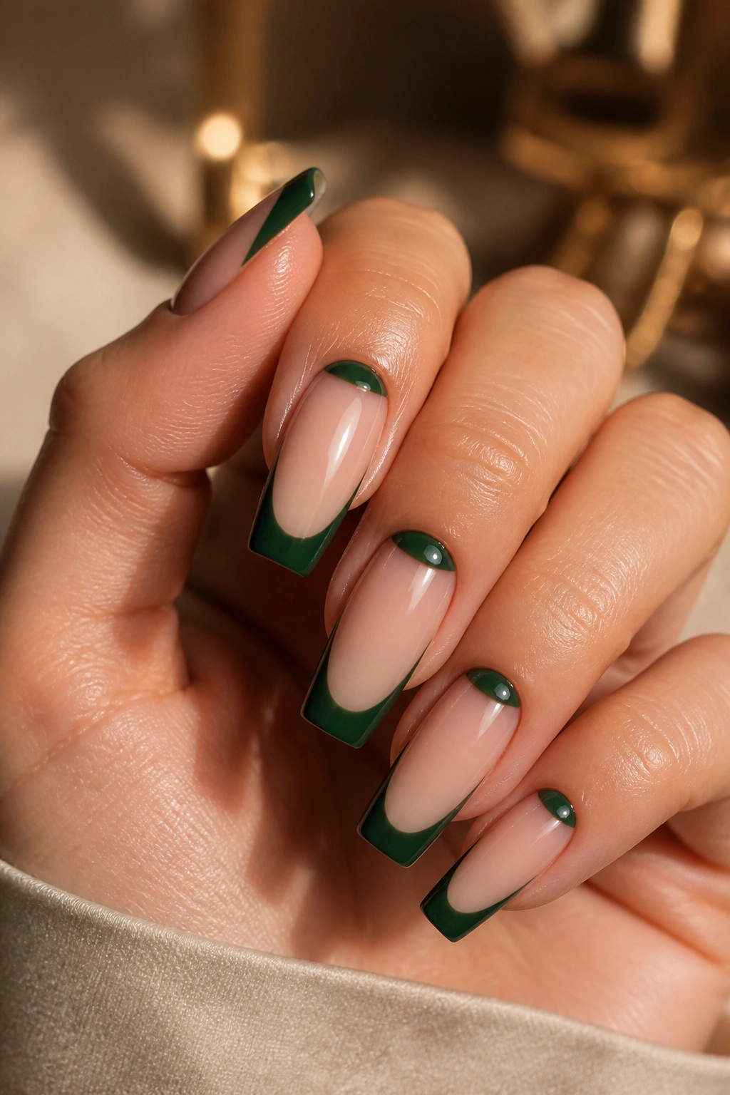 Hunter green reverse French nails with nude bed and green tips