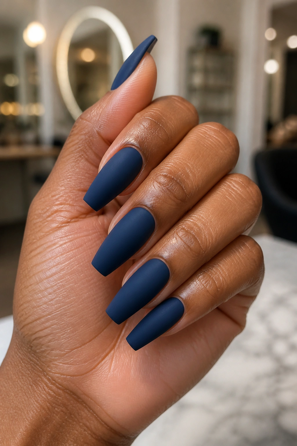 Close-up of coffin nails in soft-matte ink blue