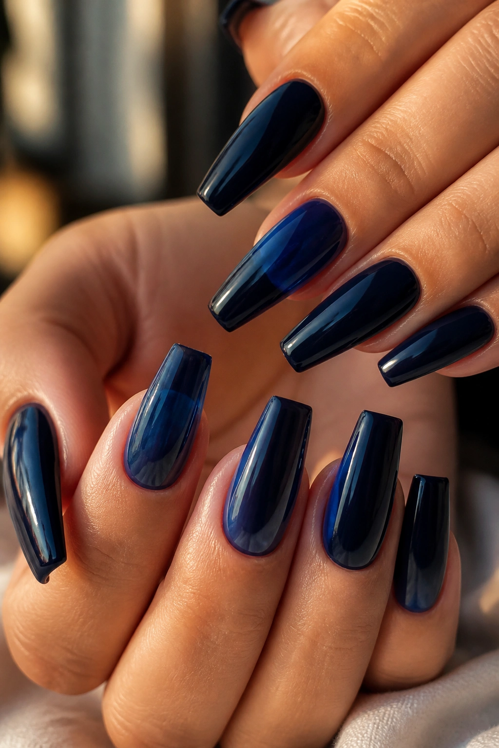 Jelly navy coffin nails showing translucency and depth on real hands