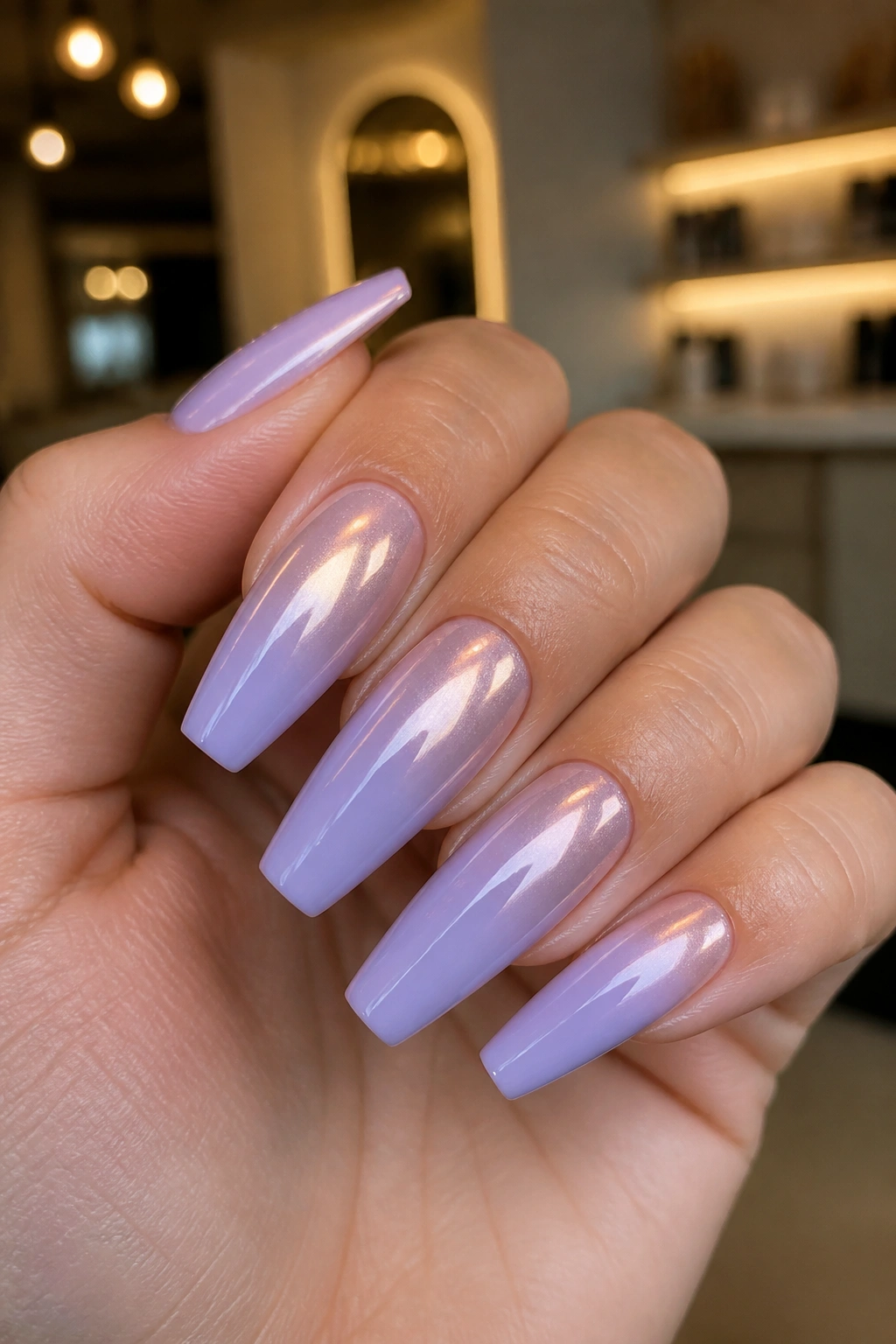 Close-up lavender coffin nails with chrome fade on a real hand.