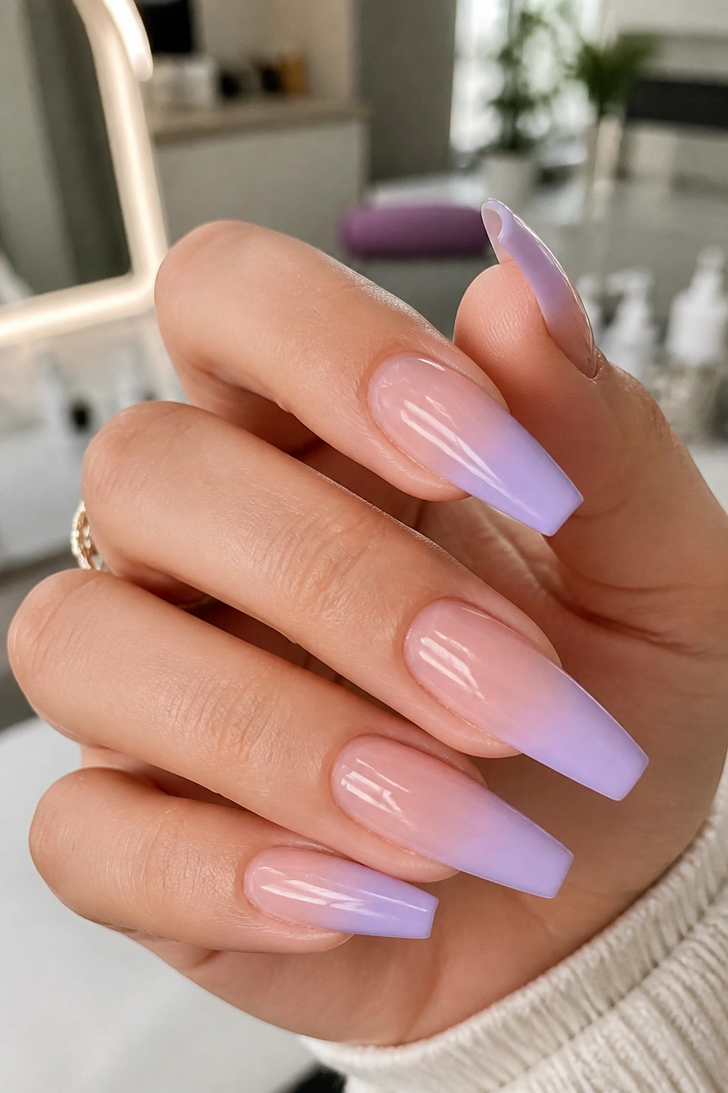 Close-up of lavender French fade nails on a real hand