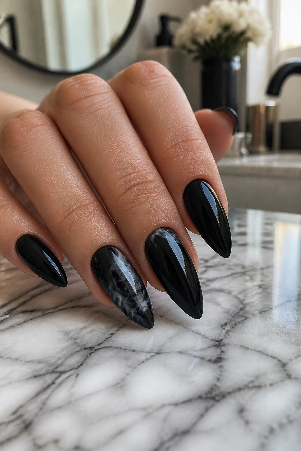 Almond nail with black base and smoky marble ribbons