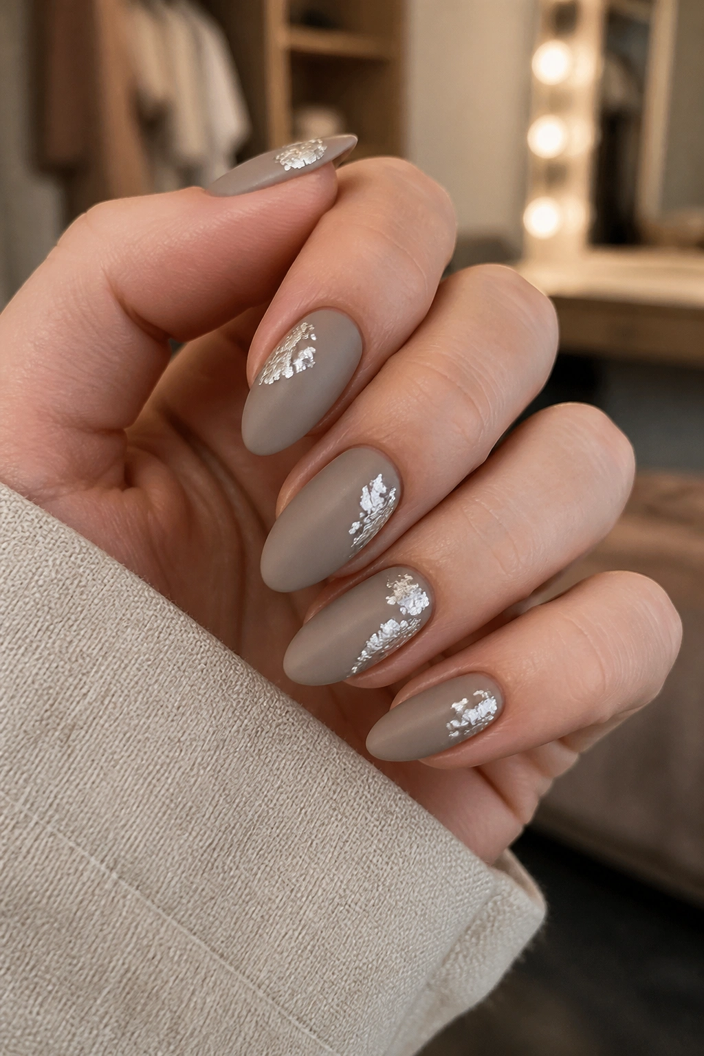 Almond nails matte taupe with off-center silver foil
