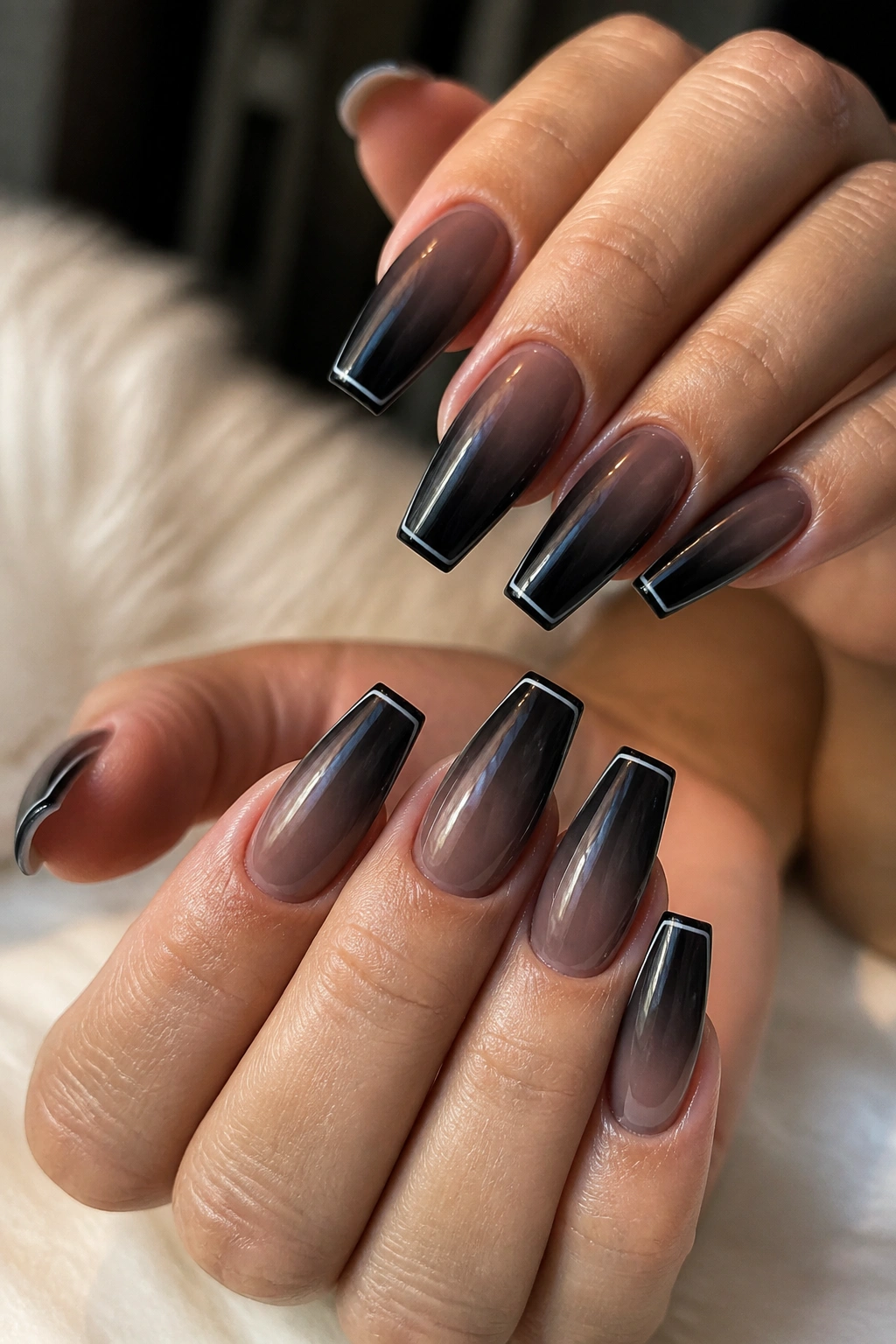 Close-up of nails with micro-French edge over soft black ombre