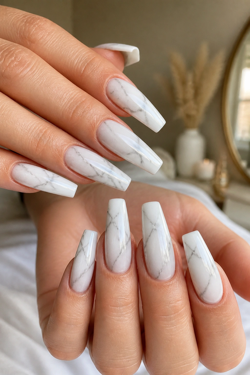 Milky white marble nails with hairline gray veins on real hands