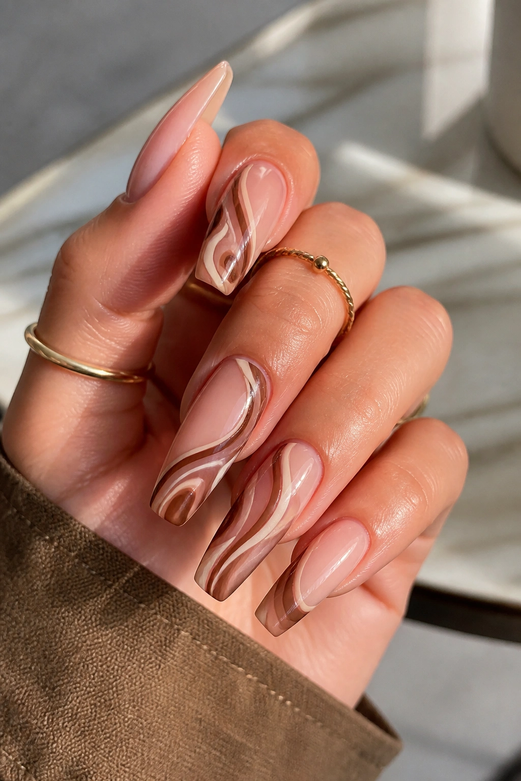 Mixed-swirl accent nails with negative space close-up