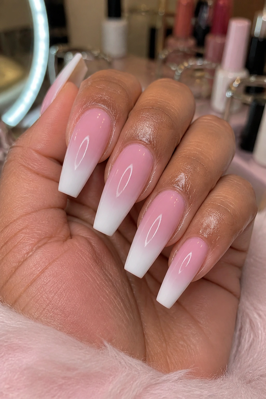 Hand with coffin nails in a salon setting