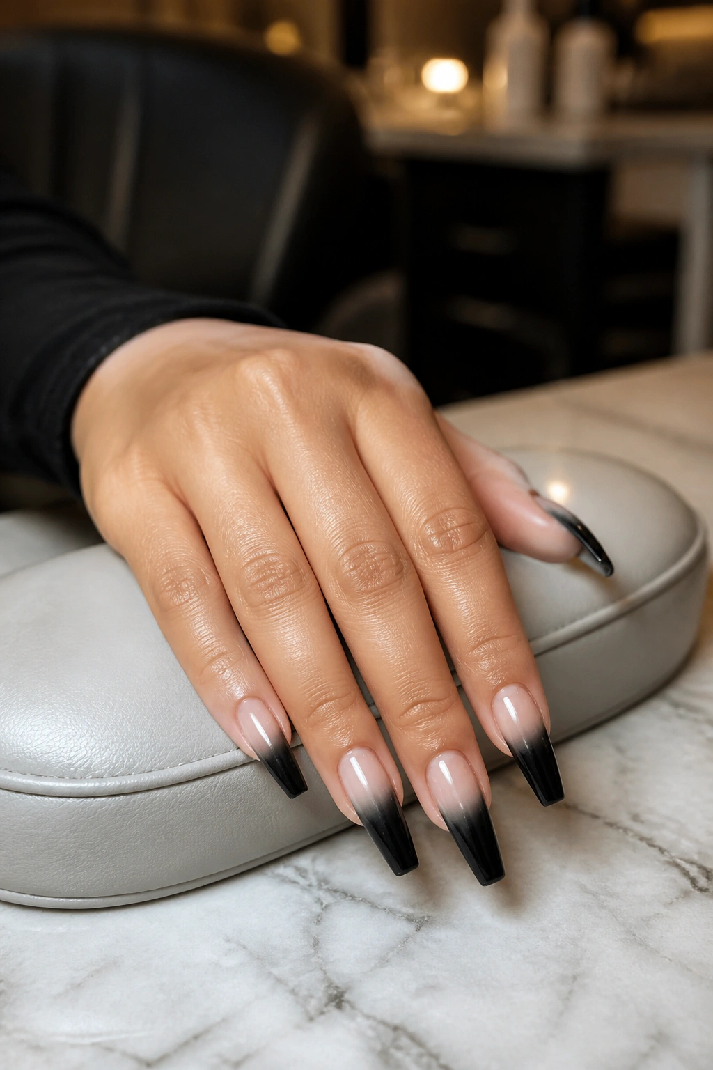 Nail hand in salon setup during initial consultation