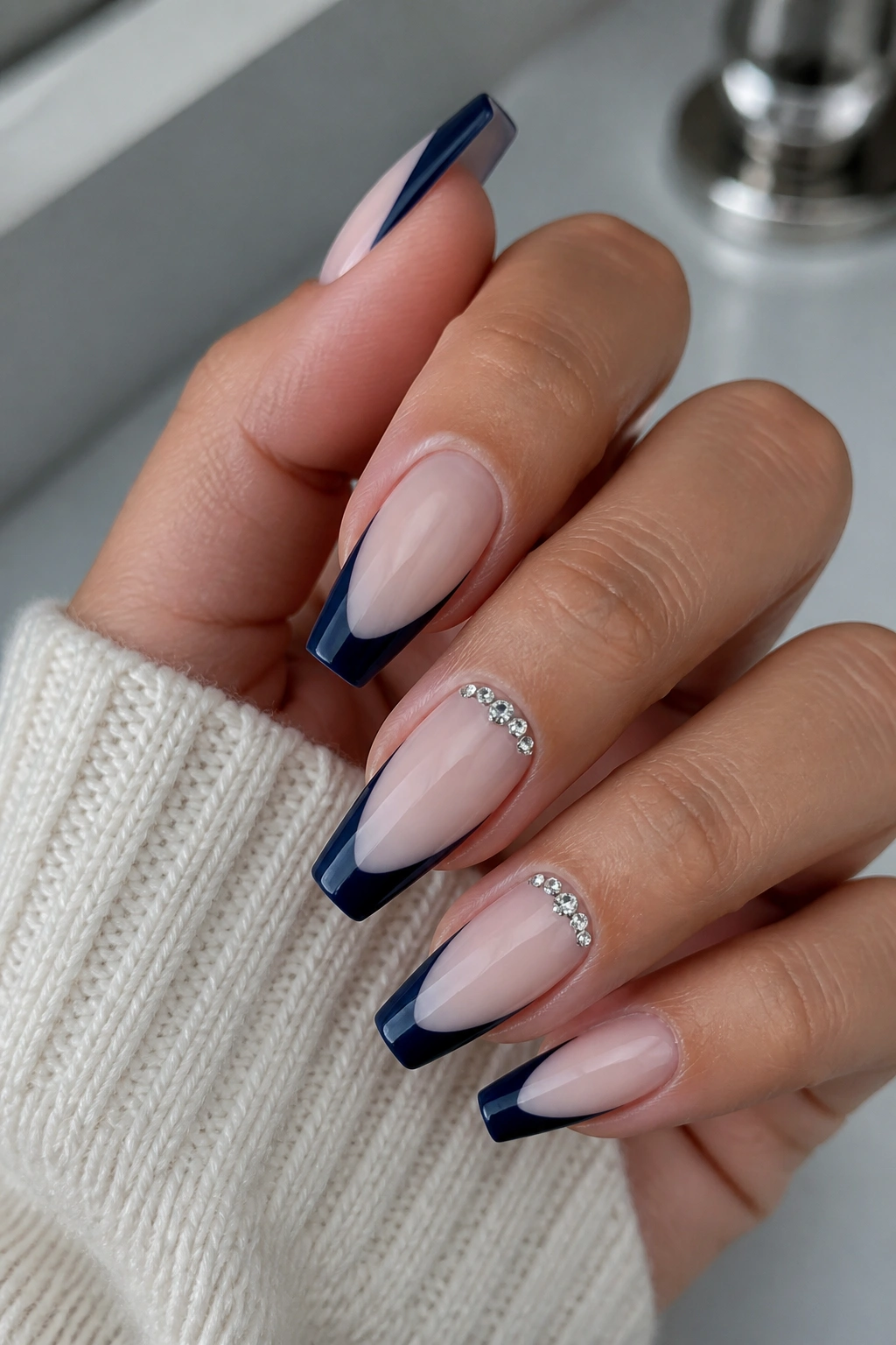Navy French tips with tiny crystals at cuticle