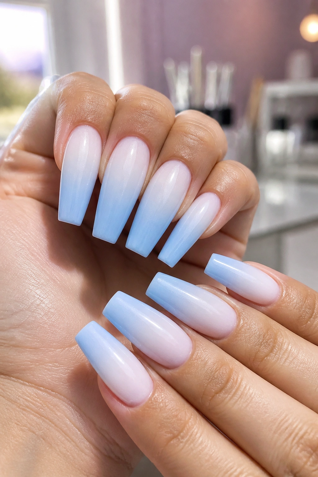 Nails with milky white to powder blue ombré coffin nails