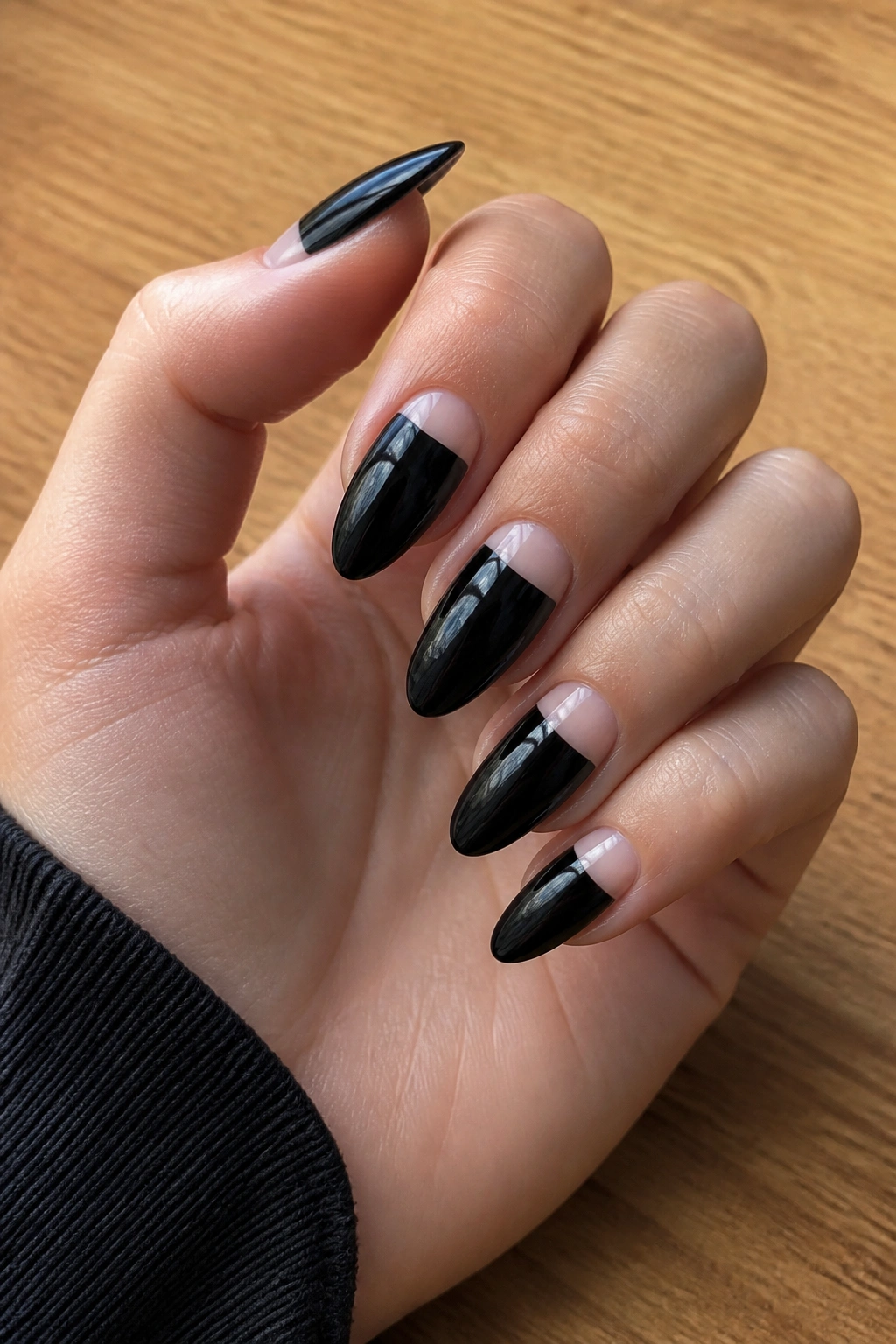 Almond nails with reverse French half-moon design at the cuticle