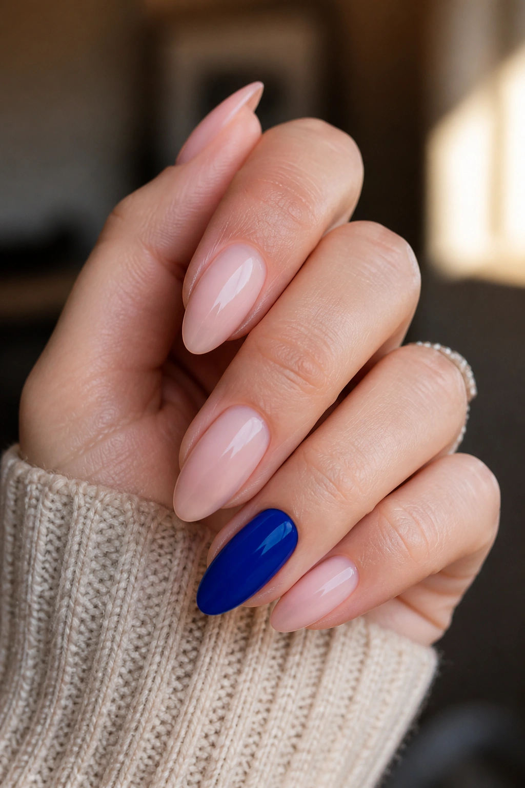 Almond nails with one royal blue accent nail