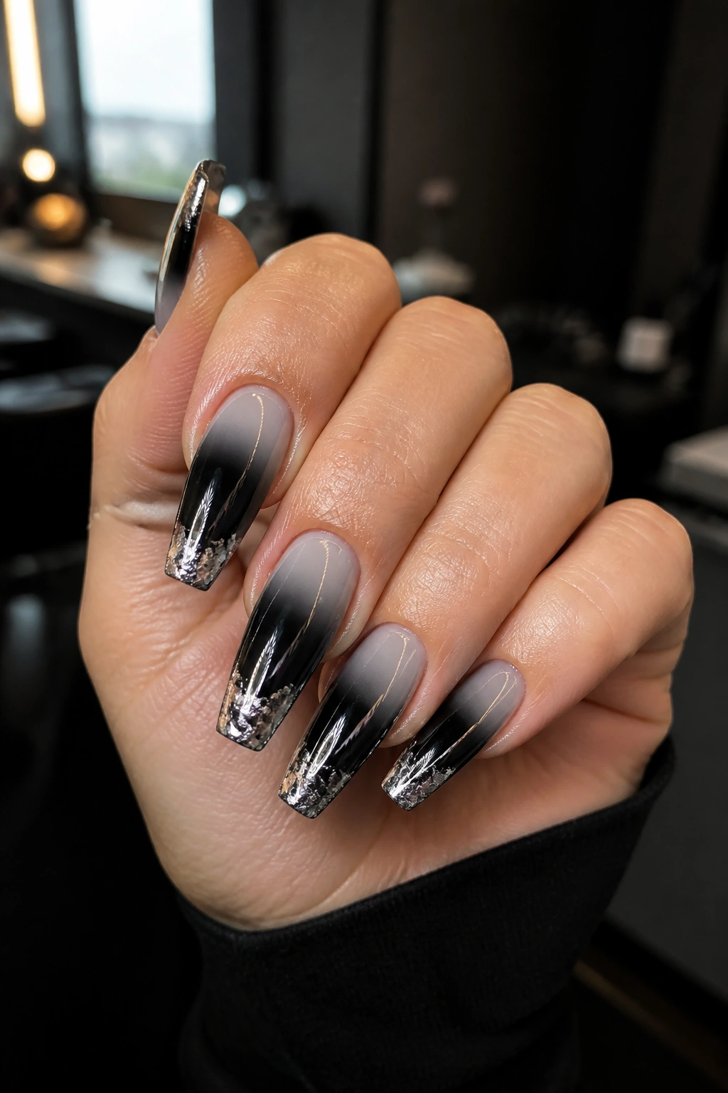 Black ombre coffin nails with silver foil-tipped accents