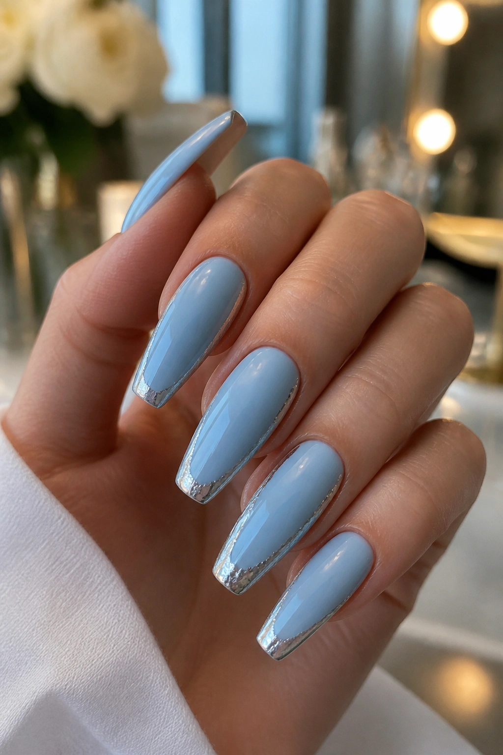 Close-up of coffin nails with silver foil along the edges
