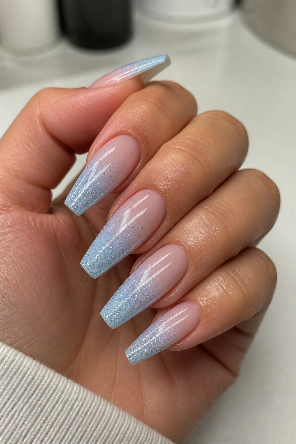 Nails with silver glitter ombre on blue coffin nails