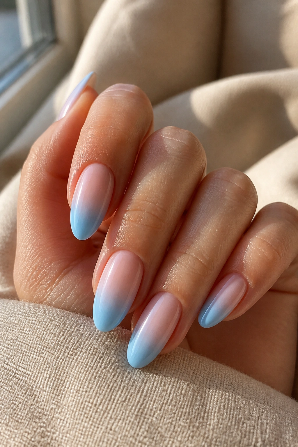 Almond nails with sky blue ombré gradient