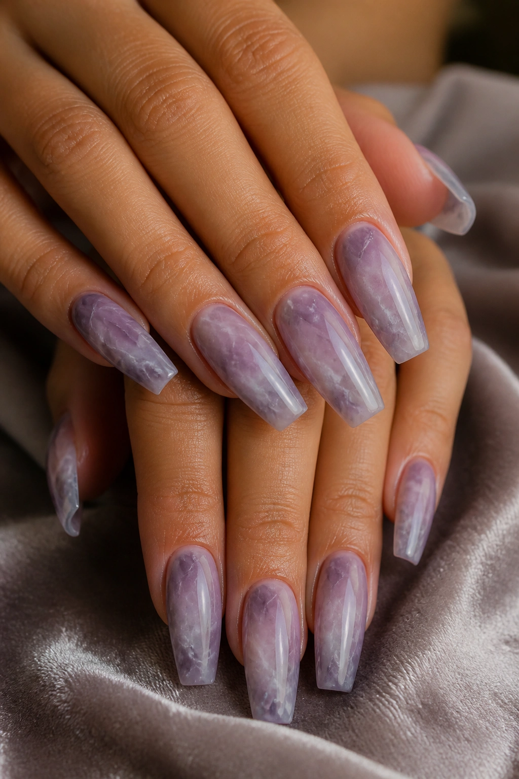 Close-up of Smoky Purple Marble With Fine White Veins on coffin nails with delicate veining.