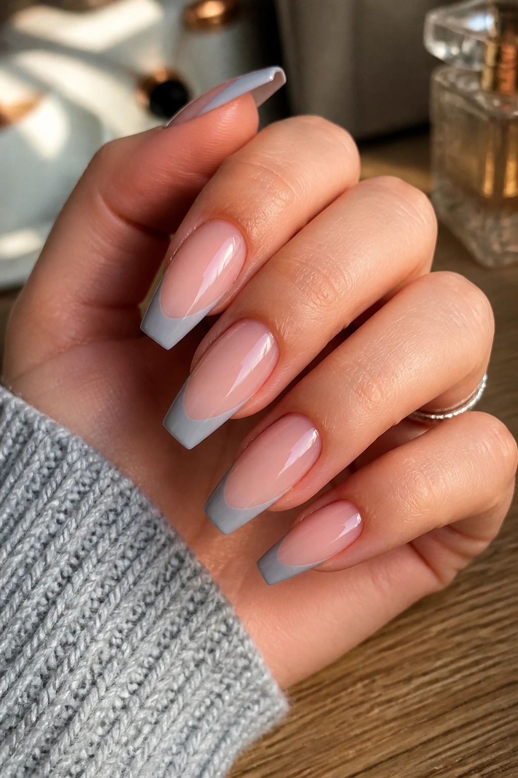 Soft grey French tips on coffin nails