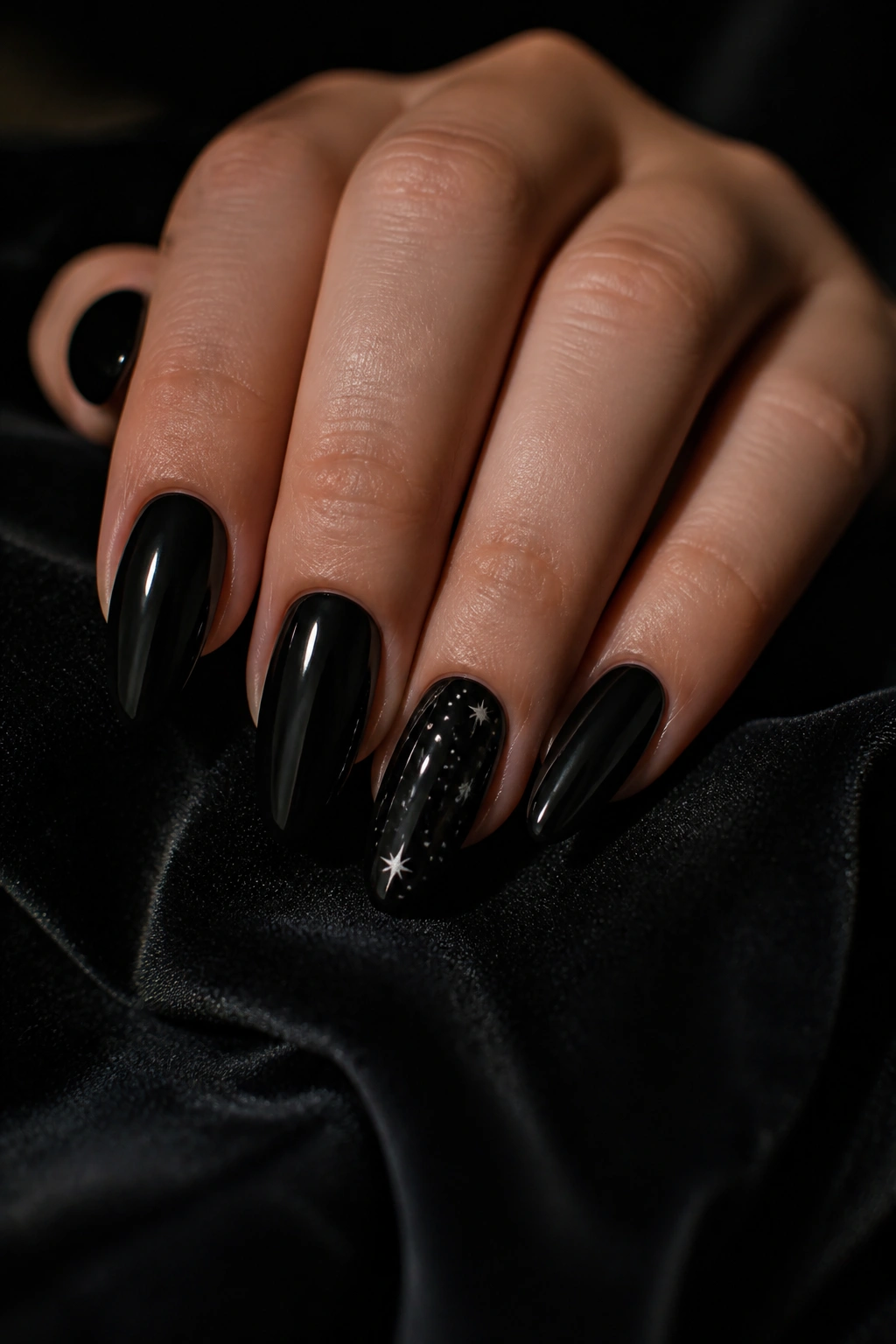 Almond nail with tiny silver stars on black base