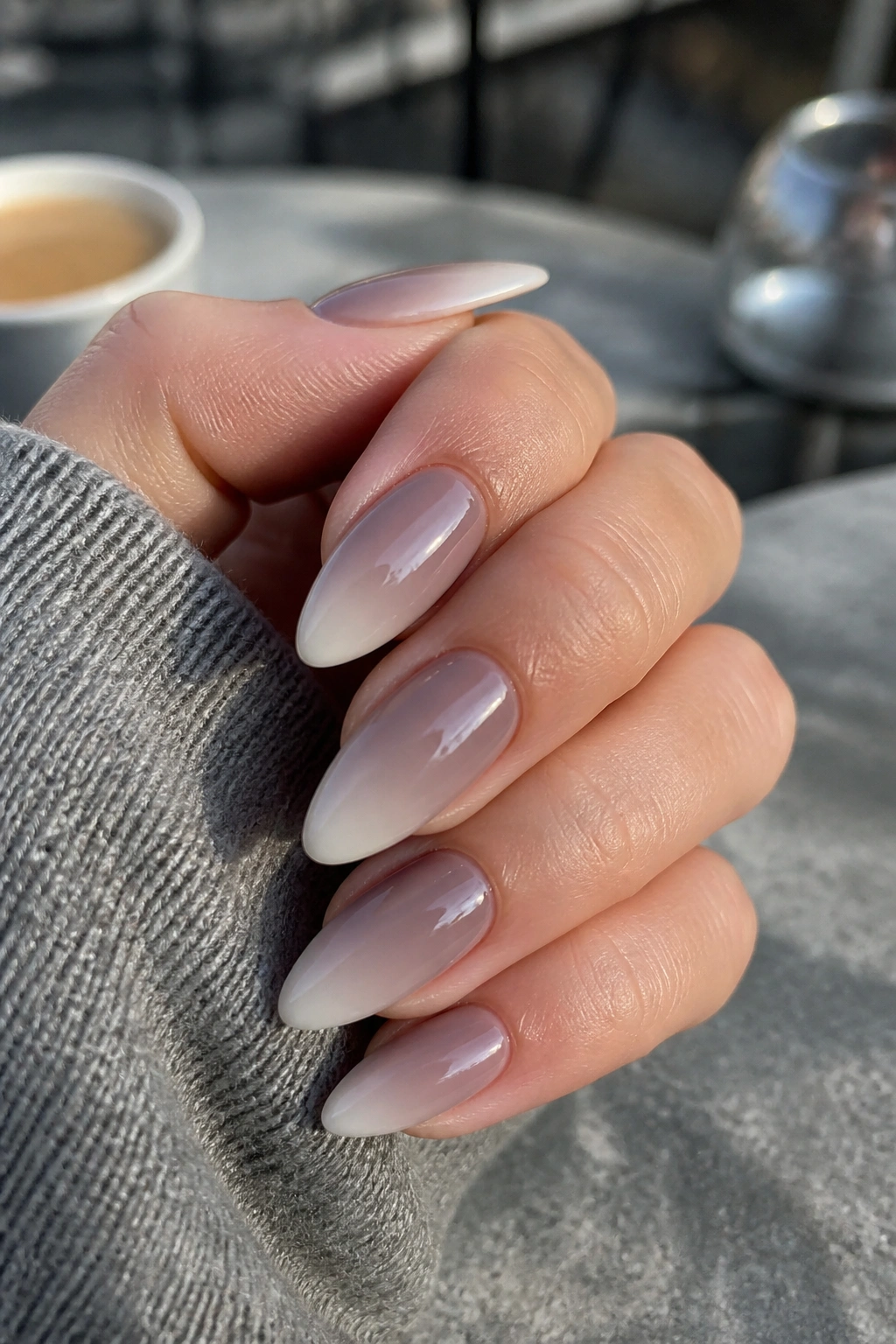 Taupe shadow ombre almond nails on real hand