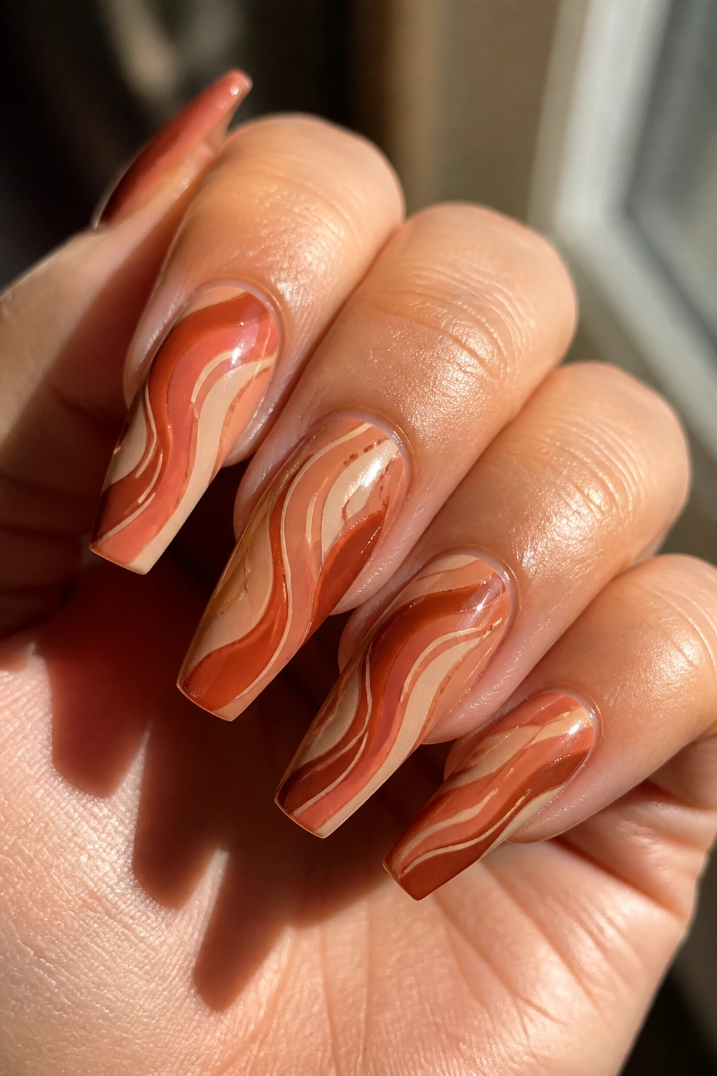 Terracotta sunset swirl coffin nails close-up