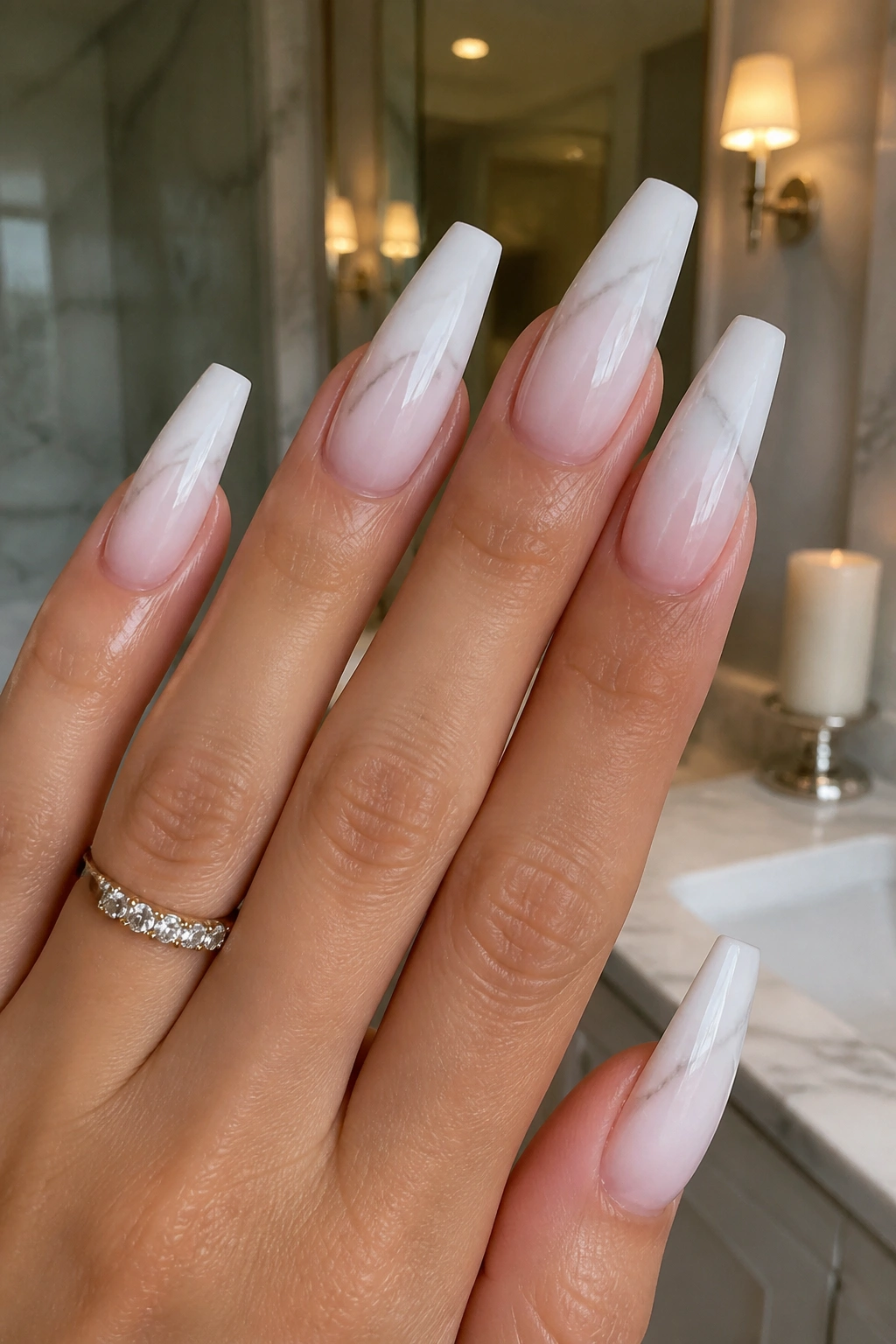 Close-up of white marble ombre coffin nails with cuticle fade