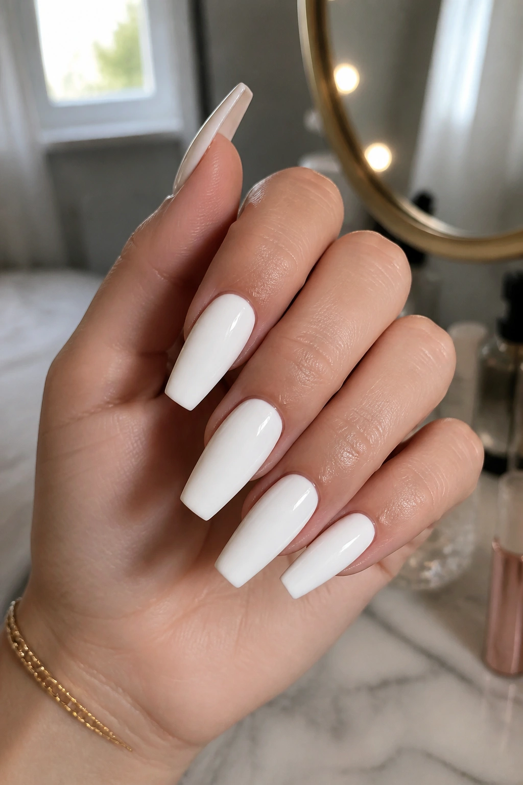 Close-up of white nails on a real hand, pristine coffin nails under natural light